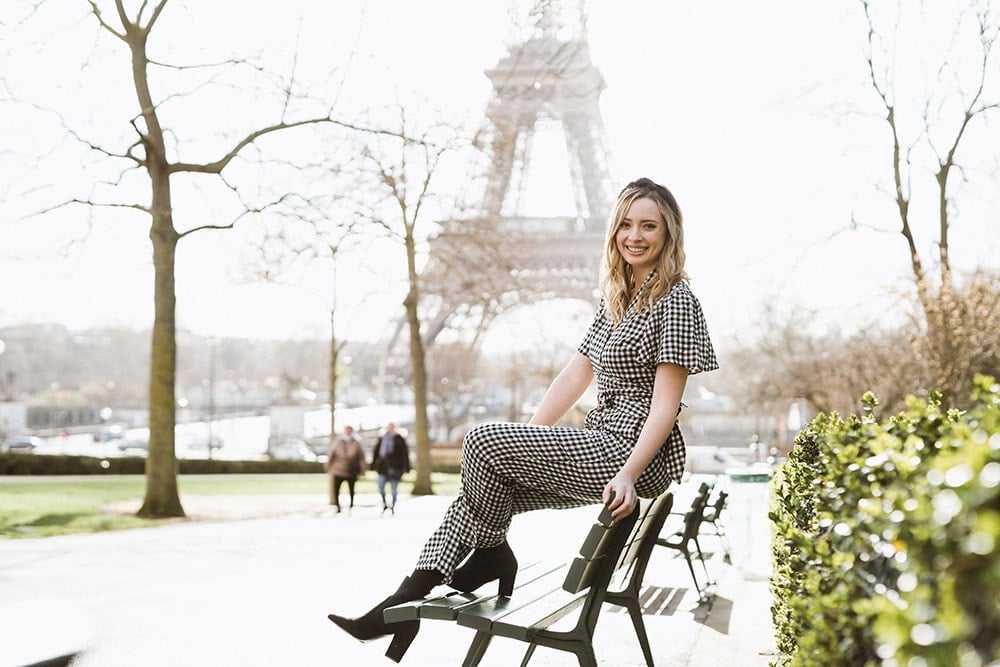 Sitting on a bench with the eiffel tower in the background