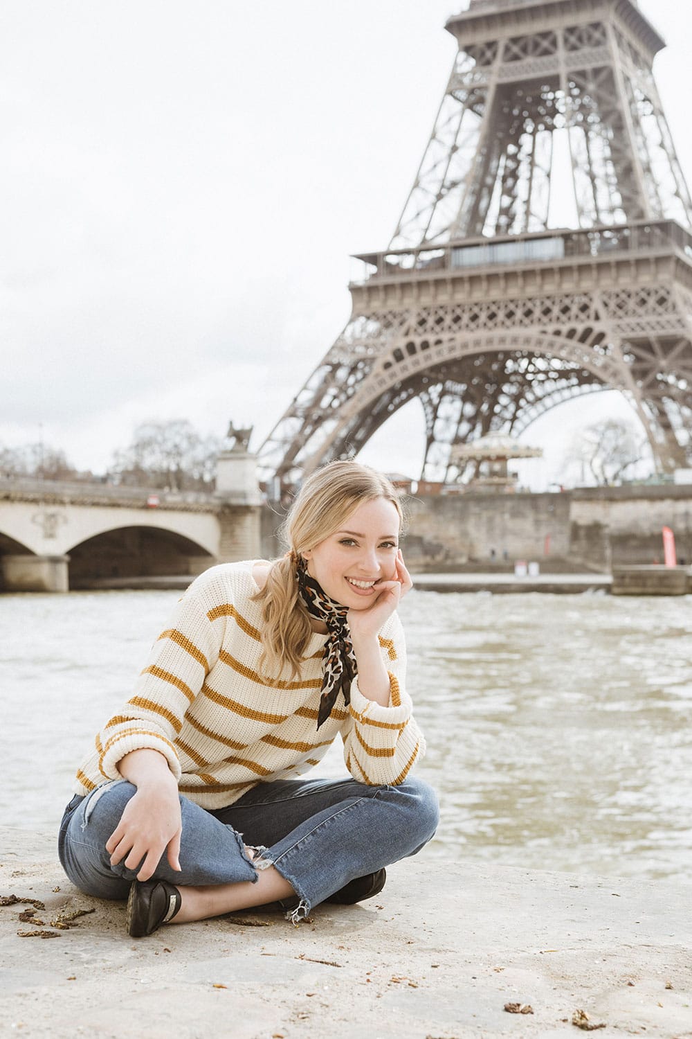 Sitting in front of the River Seine with the Eiffel Tower in the background