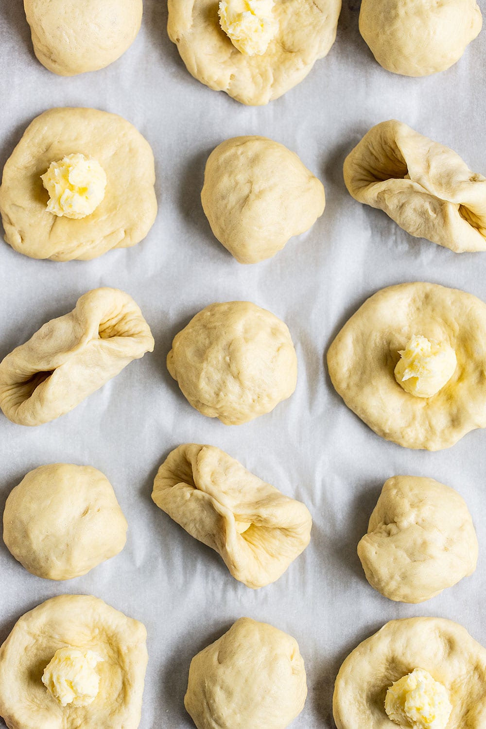 Stuffing bread roll rough with butter
