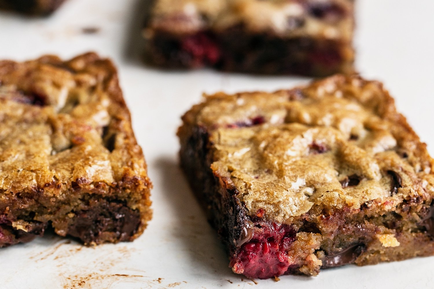 close-up of slices of raspberry chocolate blondies.