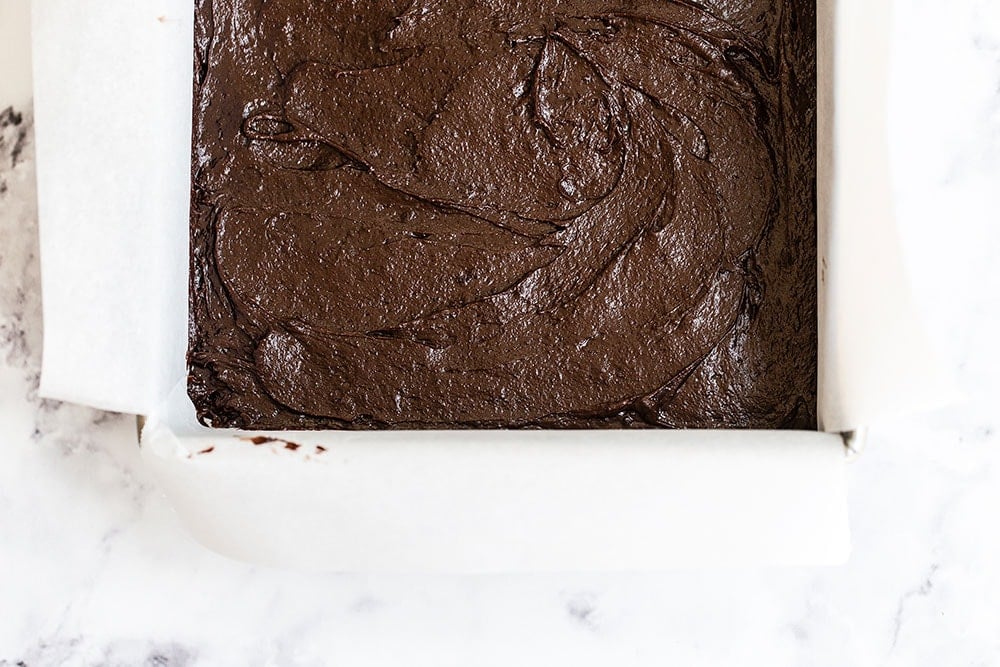 Dark chocolate brownie batter in baking pan