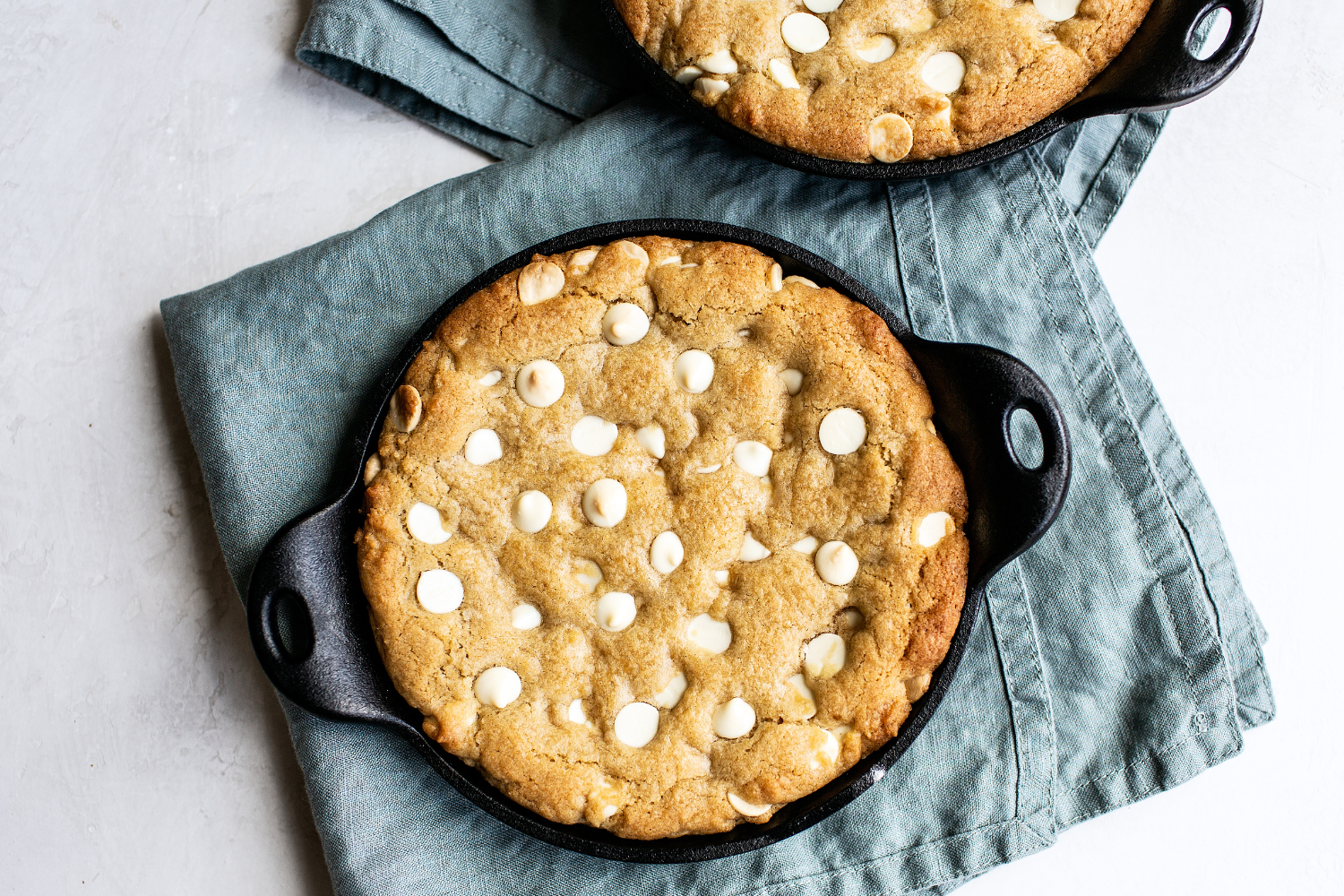 baked skillets of white chocolate chip-studded cookie
