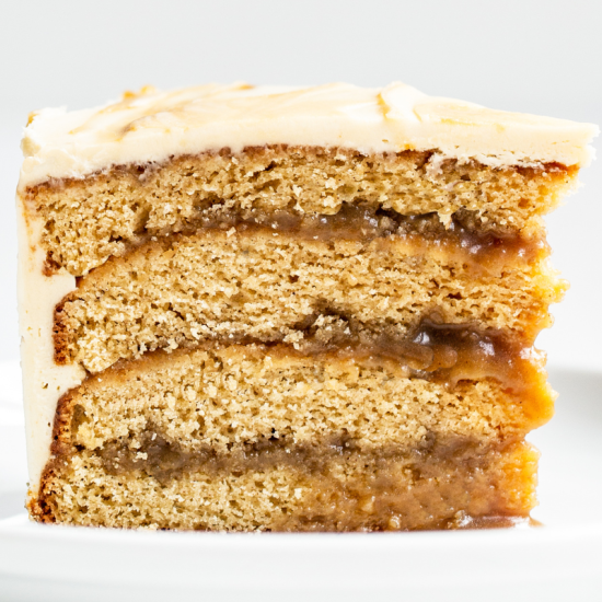 slice of brown sugar cake with butterscotch sauce and buttercream