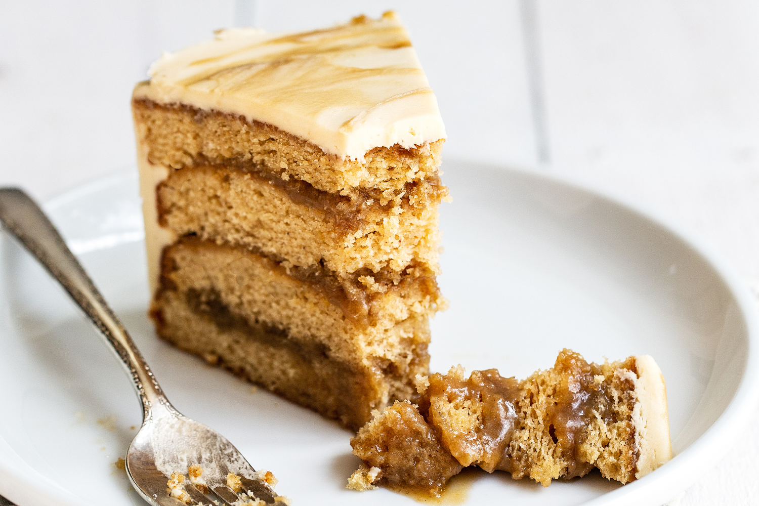 a slice of Butterscotch Cake with a bite taken out