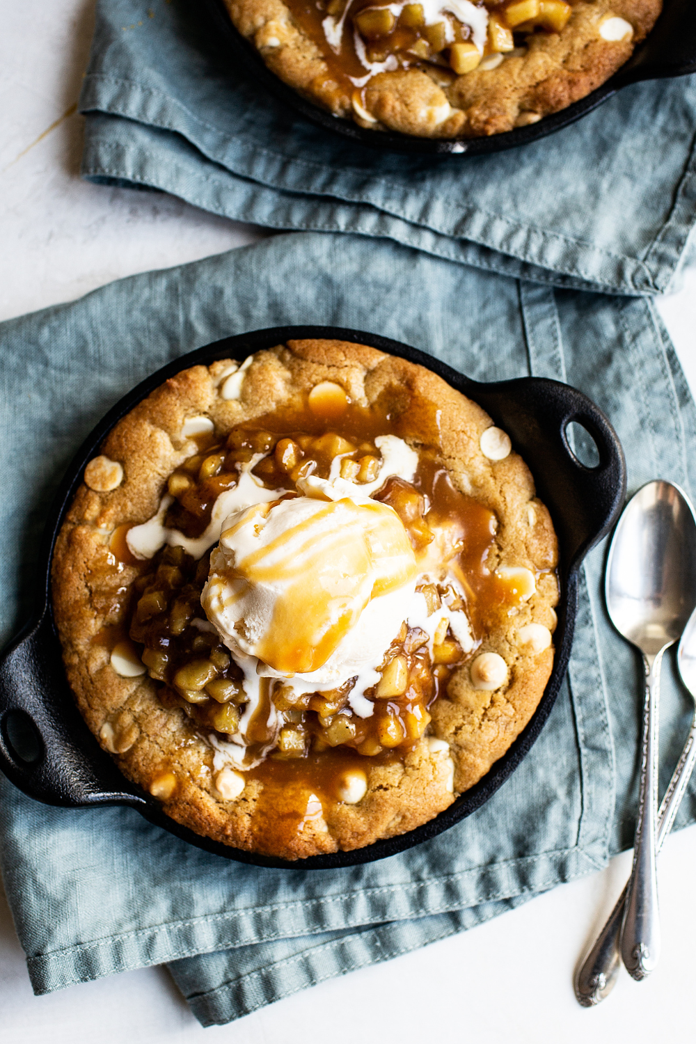 apple pie pizookies topped with salted caramel apples and ready to serve