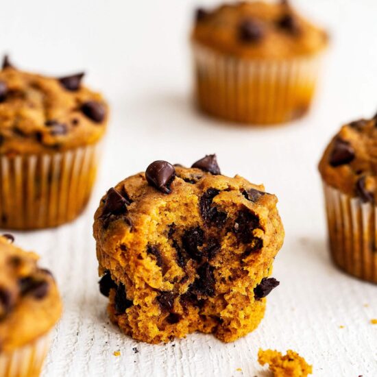 Quick and easy pumpkin chocolate chip muffins with a bite taken out