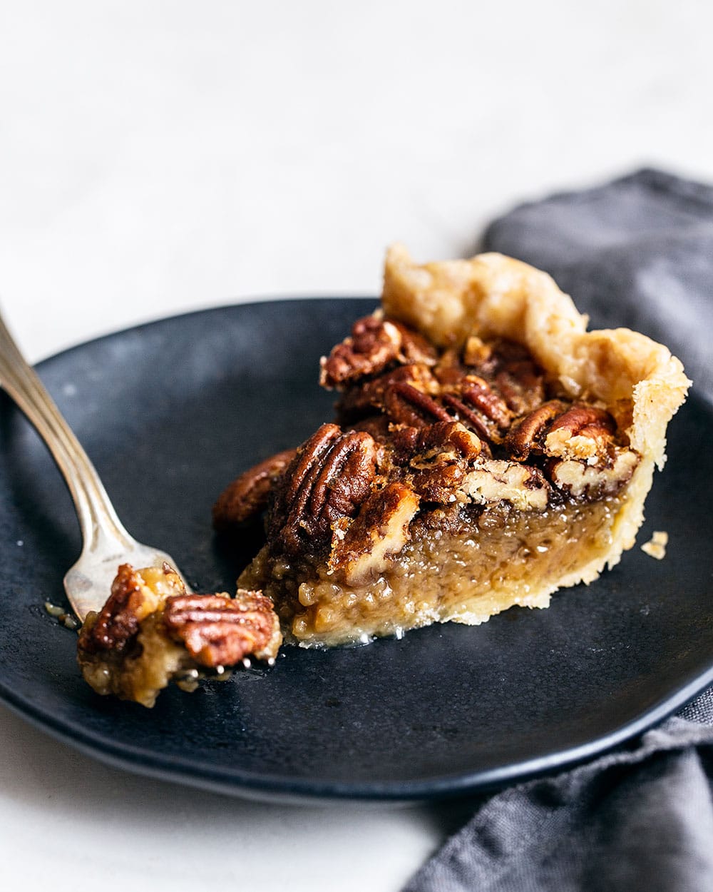 Slice of homemade Pecan Pie on a plate