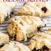 Cranberry Orange Scones are flaky and buttery with tangy buttermilk, dried cranberries, fresh orange zest, and a simple orange icing. Freezer friendly! Easy homemade, from-scratch recipe that tastes like a traditional English scone!