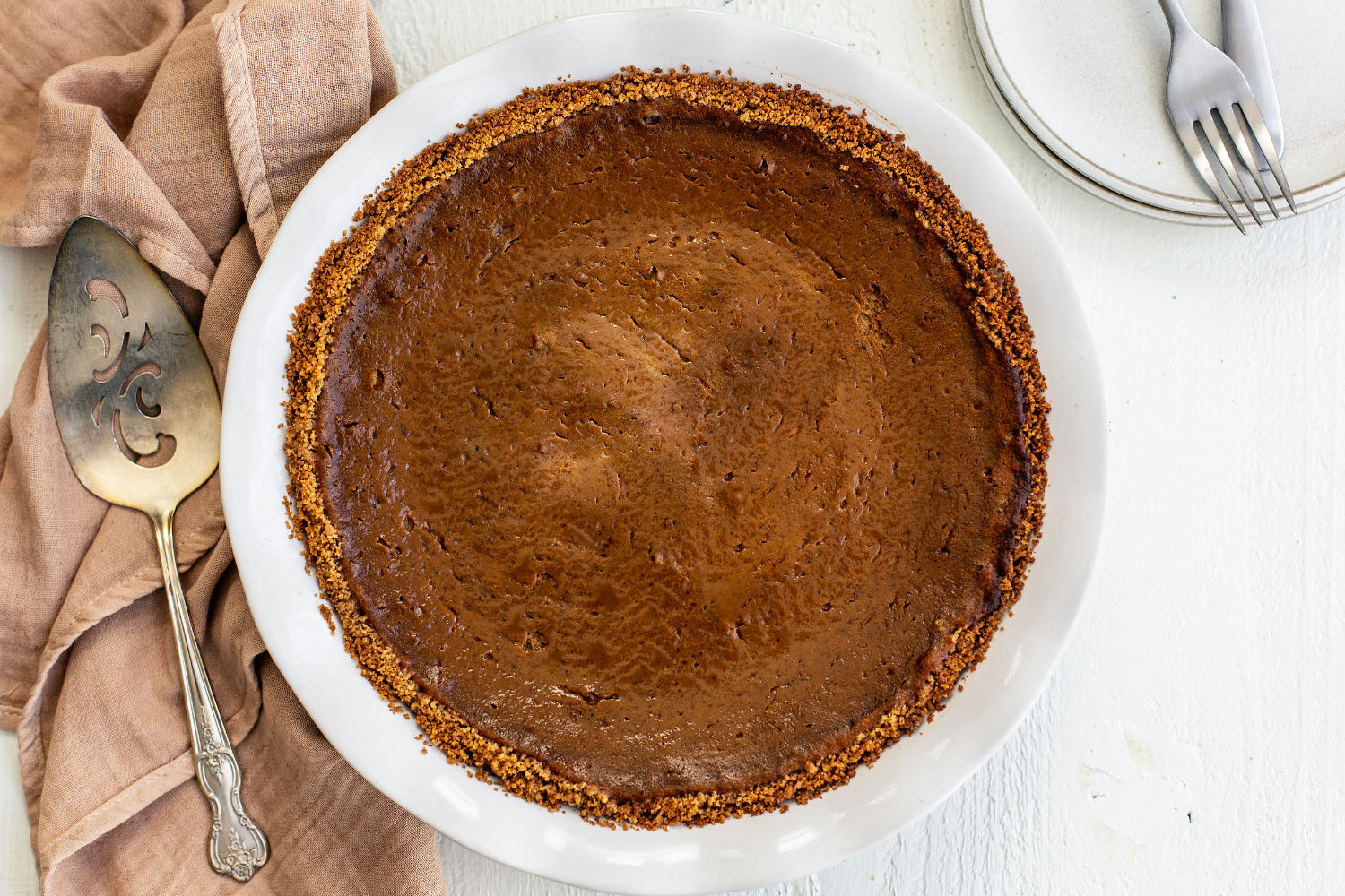 whole baked pumpkin pie, unsliced and ready to add whipped cream.