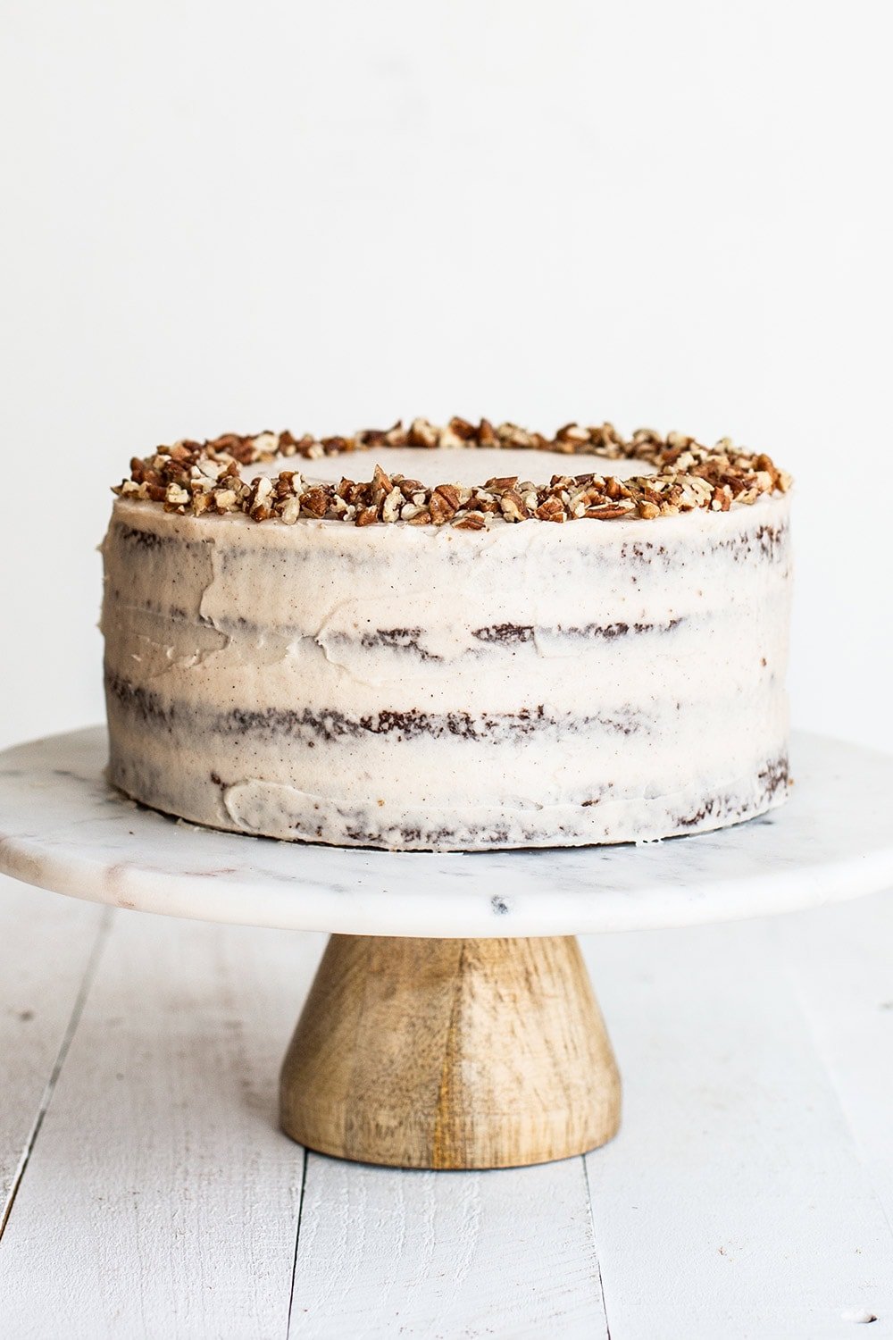 Four-layer brown butter carrot cake on a cake stand