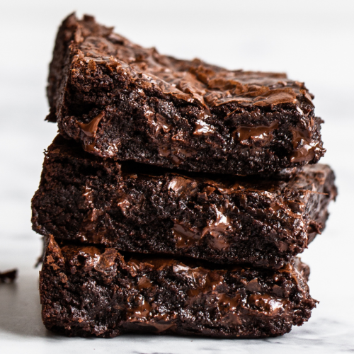 slices of gooey, fudgy brown butter brownies stacked three high