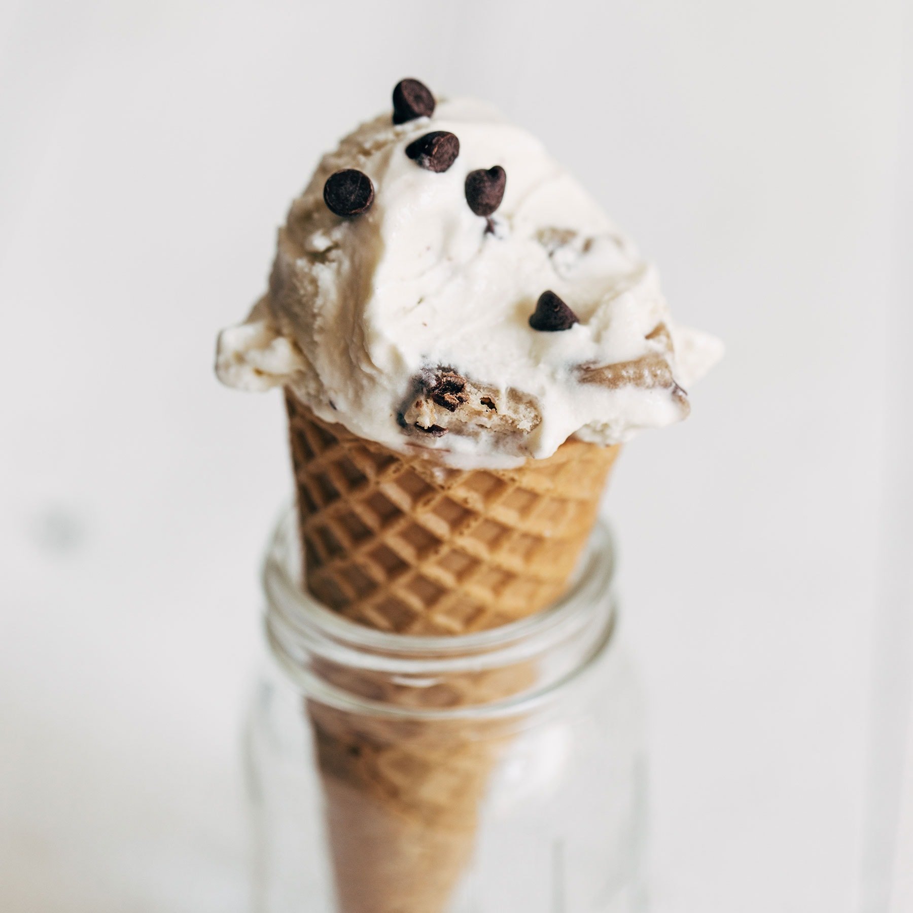 Scoop of homemade chocolate chip cookie dough ice cream in ice cream cone