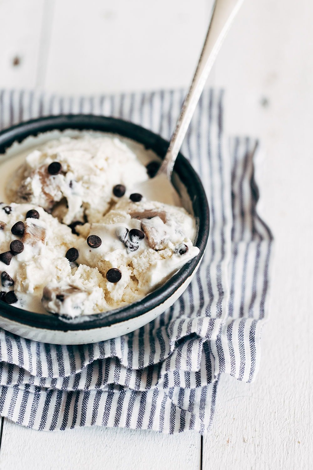 Bowl of chocolate chip cookie dough ice cream with a spoon