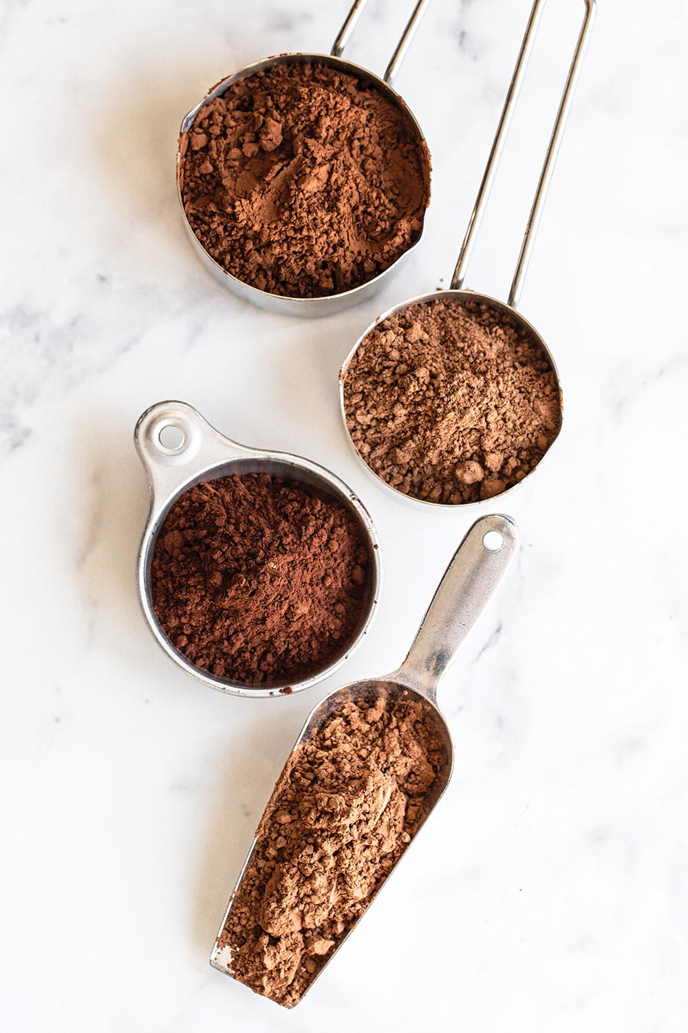 cocoa powder and dutch processed cocoa powder in measuring cups