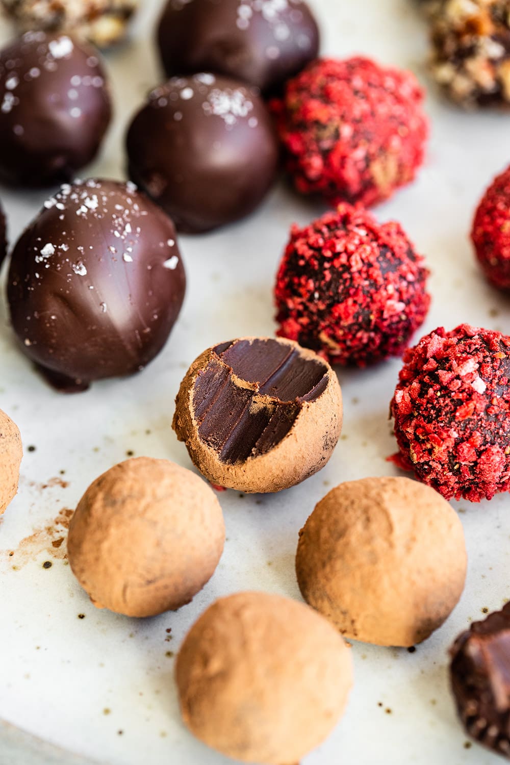 assortment of easy chocolate truffles with bite taken out of one