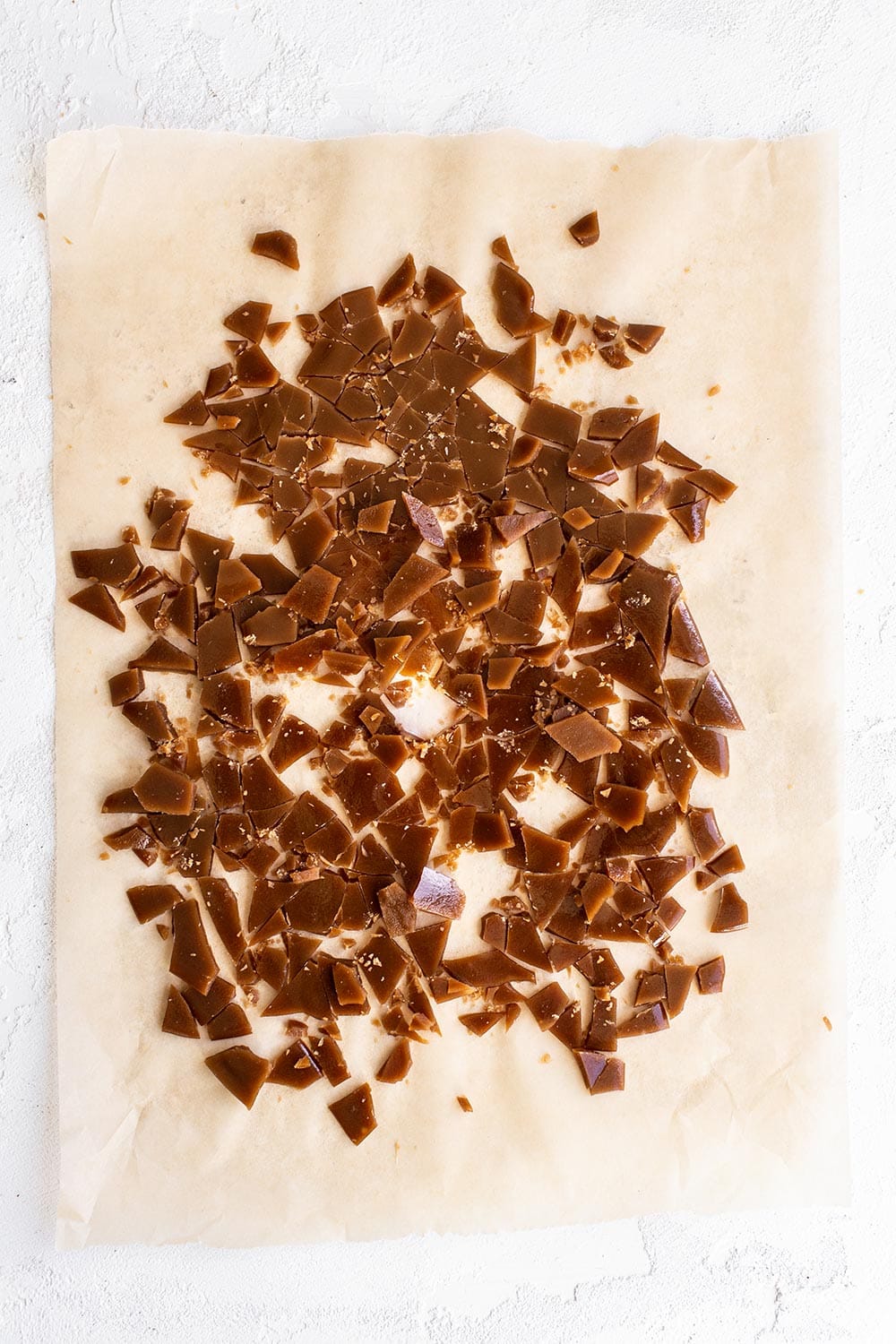 chopped up copycat Heath toffee bits on parchment paper