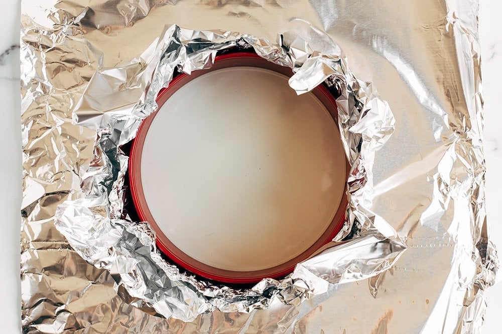 tinfoil wrapped around a springform pan for a cheesecake water bath