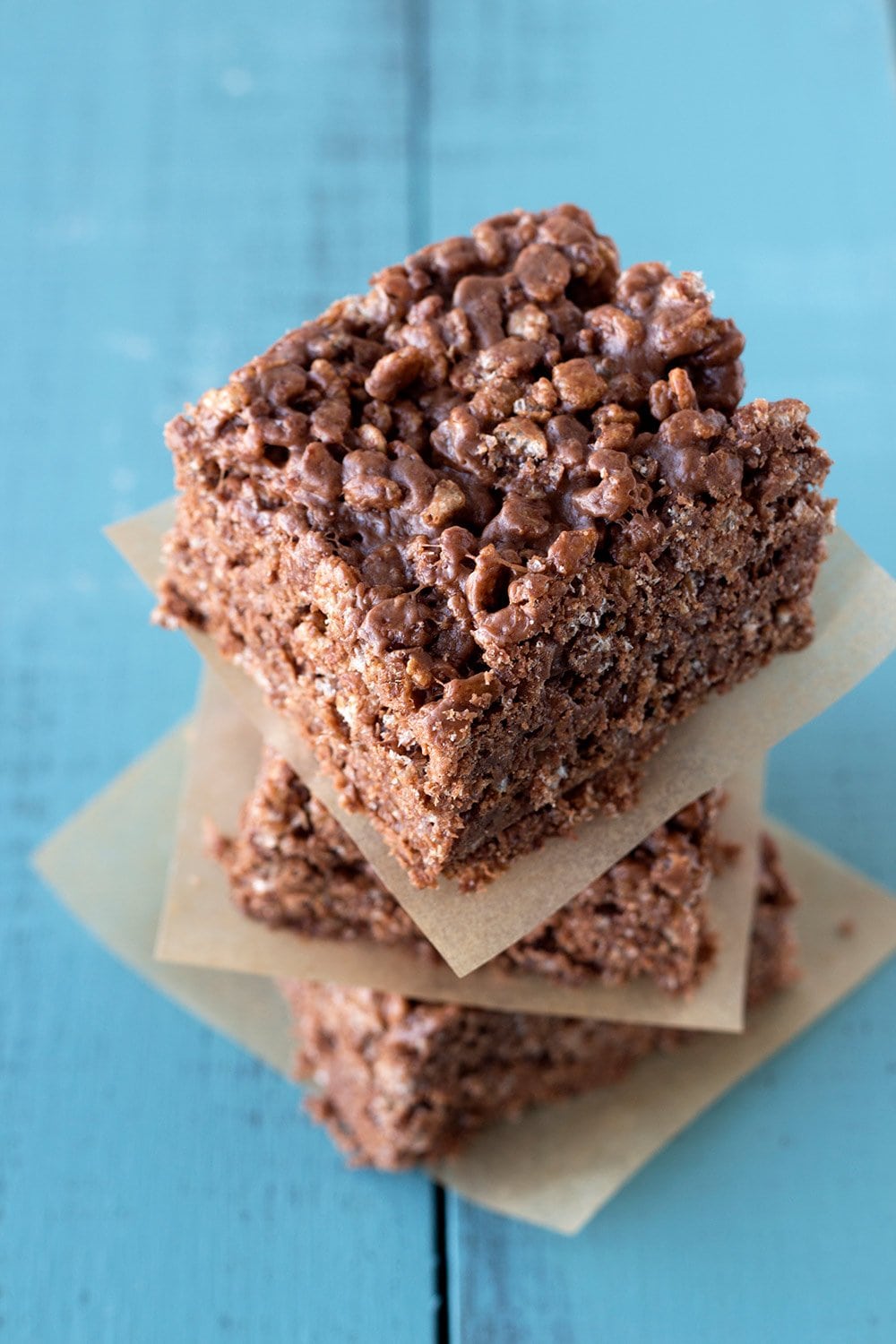 Nutella Peanut Butter Rice Crispy Treats with a blue background