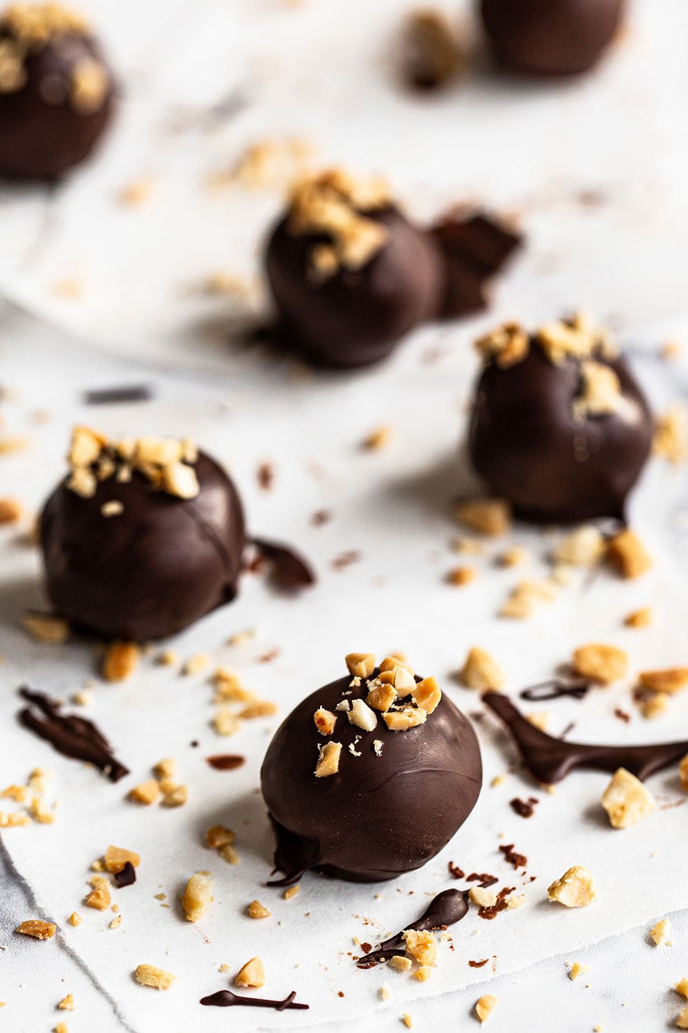 homemade chocolate peanut butter whiskey truffles on parchment paper
