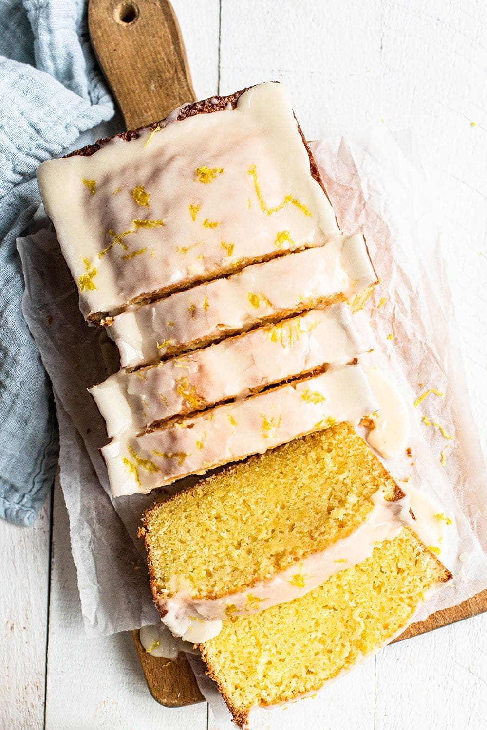 slices of homemade moist lemon pound cake on a wooden board