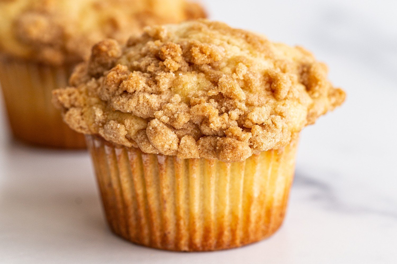 a muffin topped with cinnamon streusel.