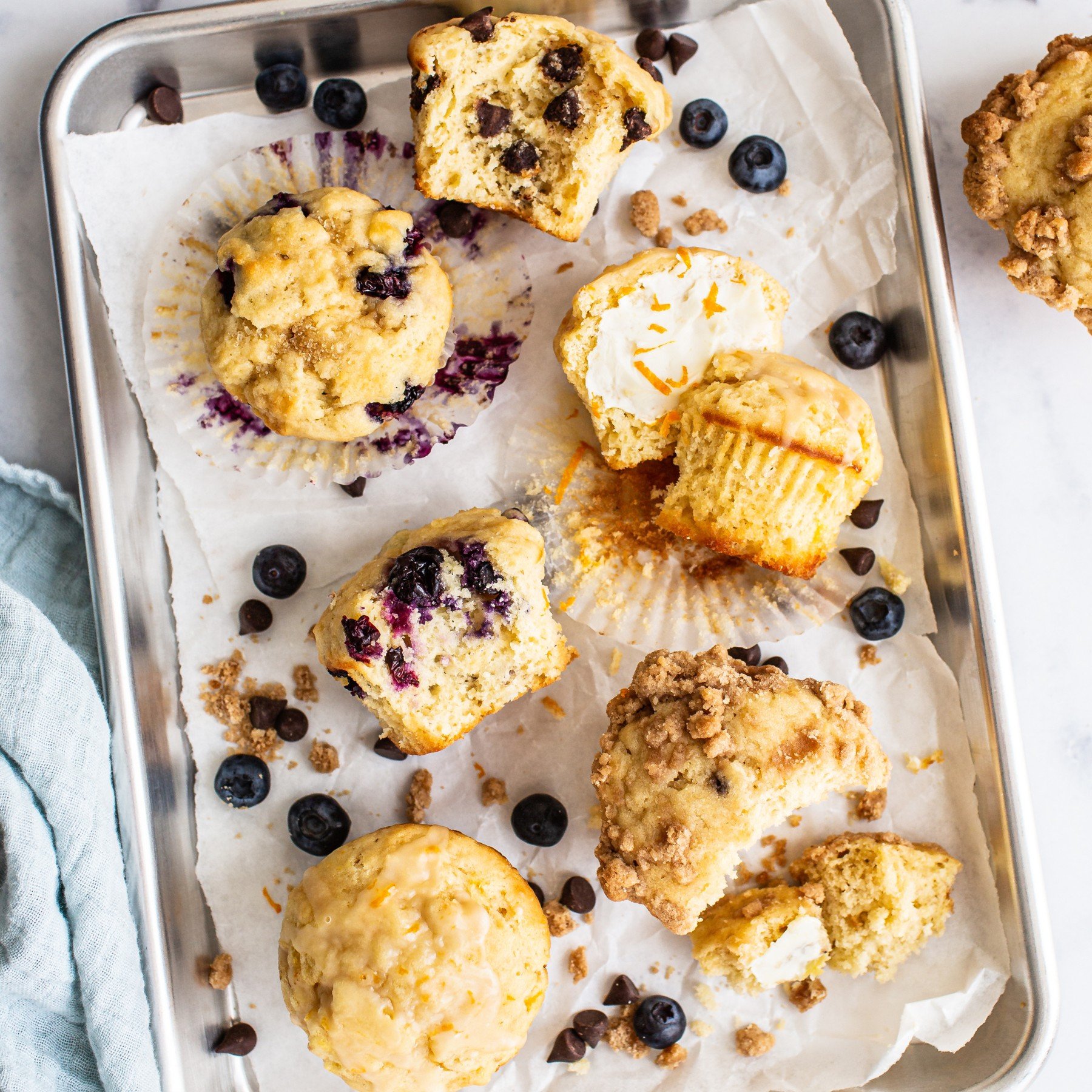 a tray of muffins of assorted flavors.