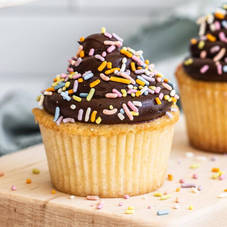 light, fluffy and moist yellow cupcakes with chocolate frosting and sprinkles