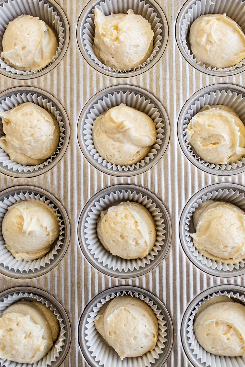 easy homemade yellow cupcake batter in muffin tin