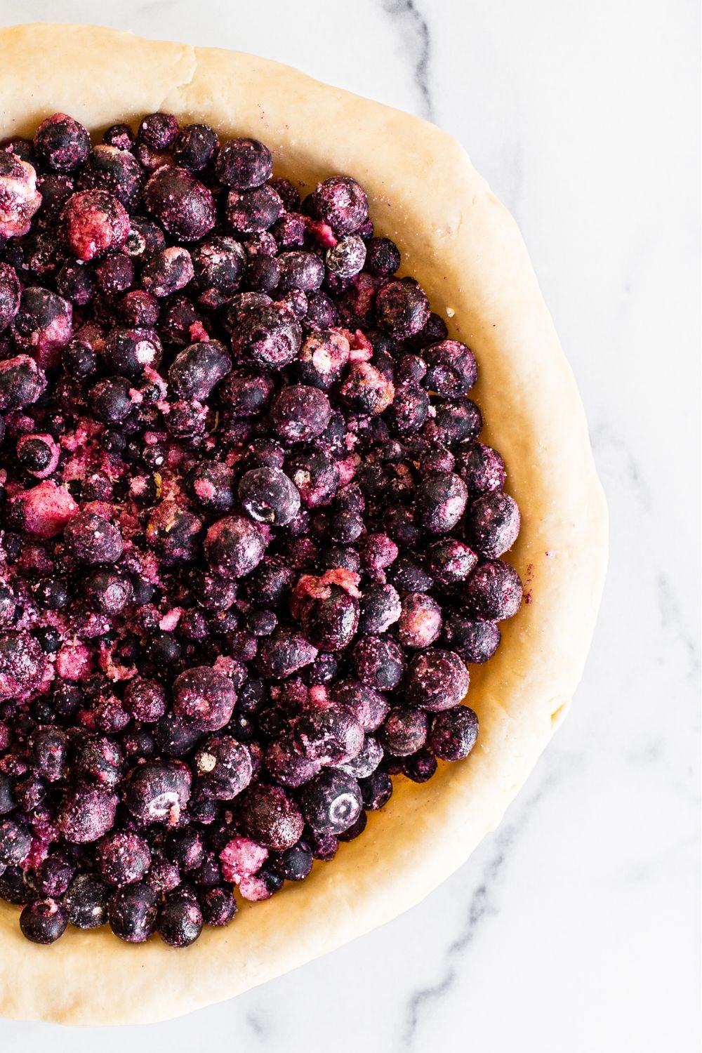 filled pie crust, ready for the top crust before baking.