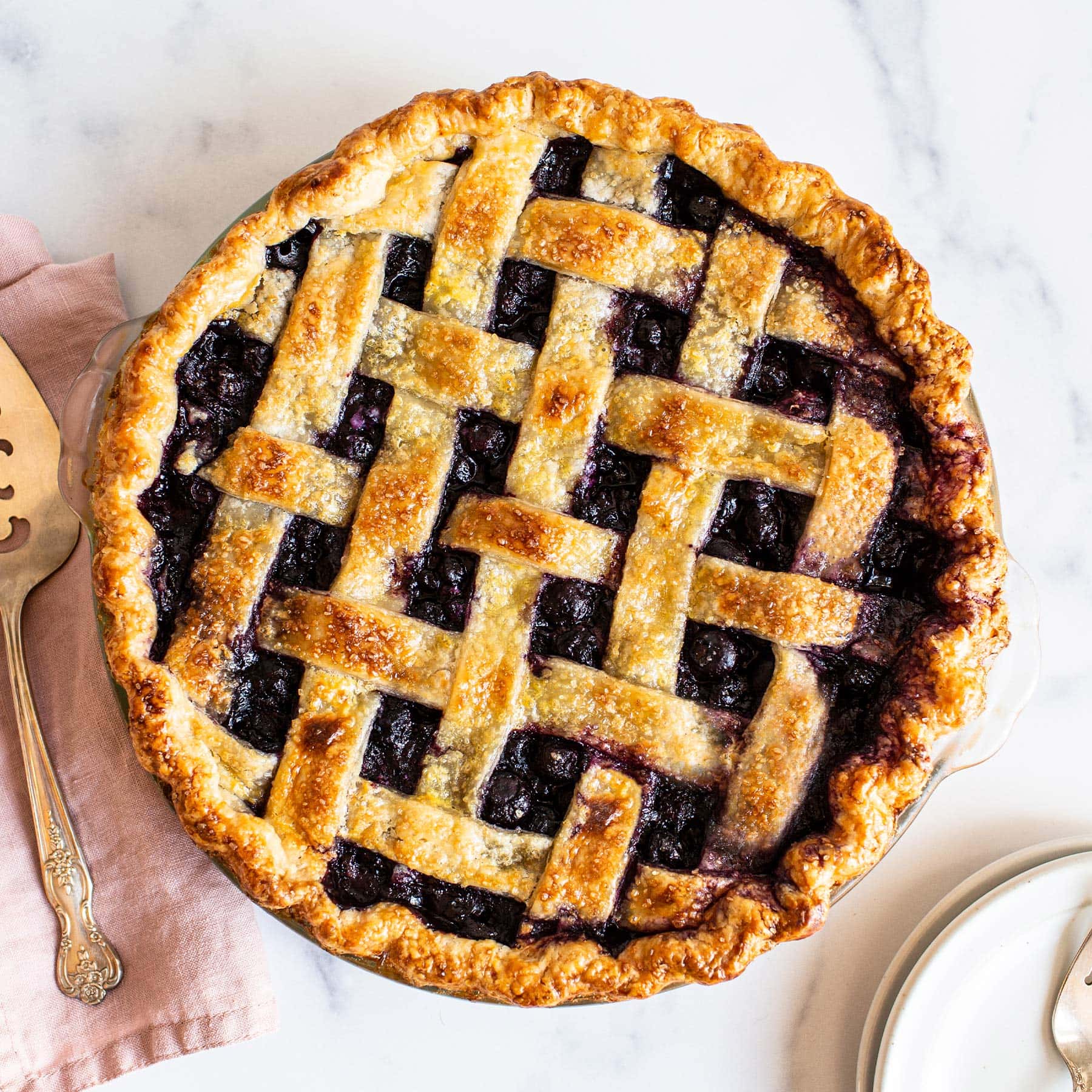 homemade blueberry pie with a lattice pie crust on top