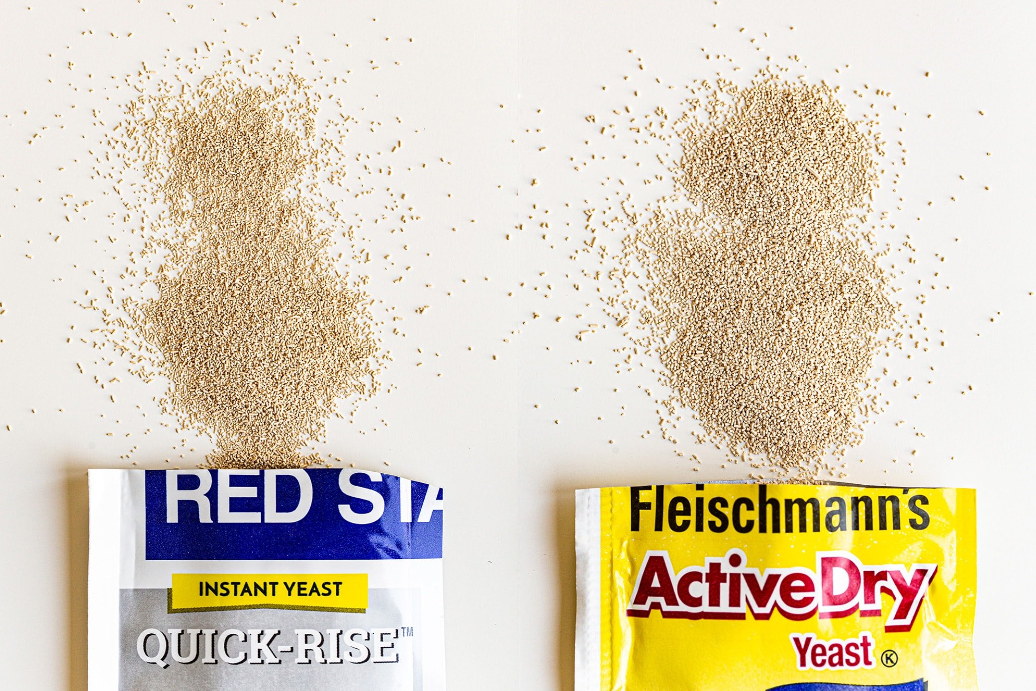 two packets of instant yeast on the left and active dry yeast on the right.