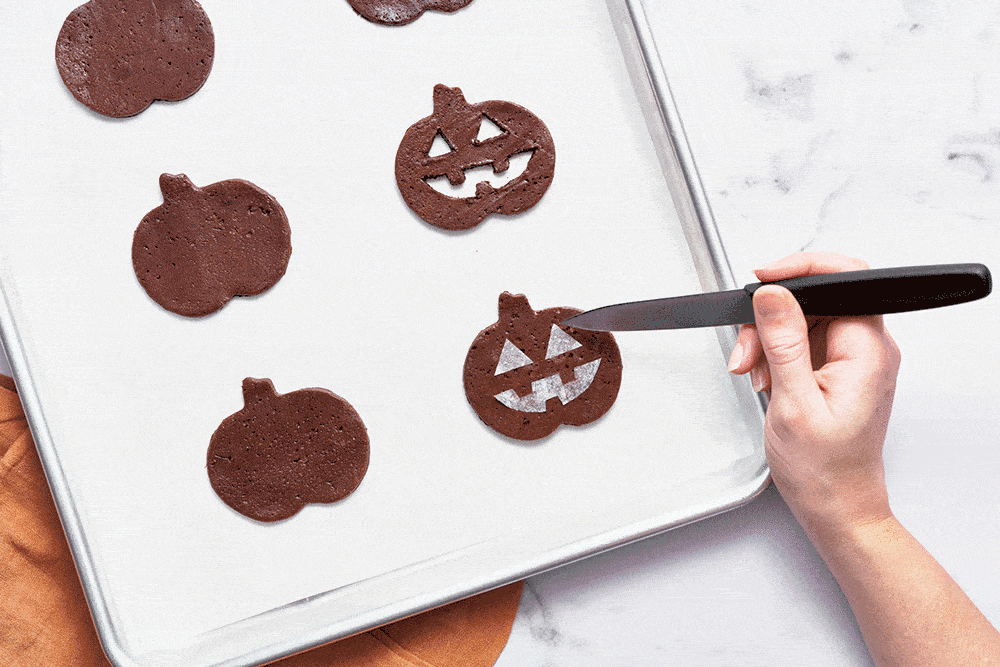 how to cut out shapes using a paring knife for jack o lantern halloween cookies