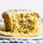 moist and tender lemon poppy seed muffin with a bite taken out, so you can see the interior texture
