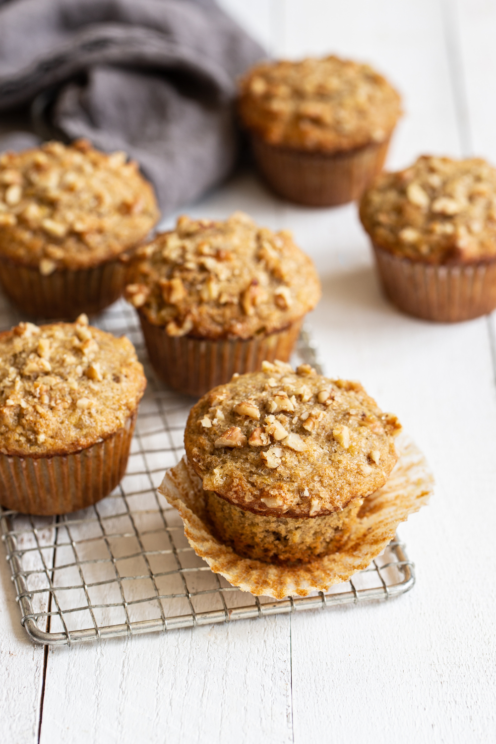 banana nut muffins cooling on a rack, ready to be enjoyed!