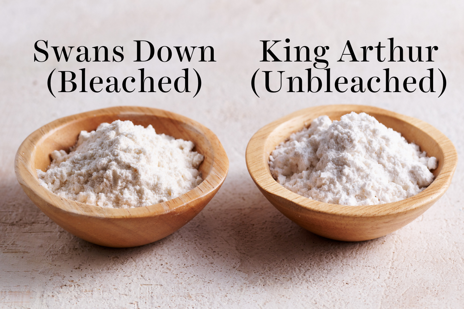 two small bowls of cake flour next to each other. one is Swans Down and the other is King Arthur.