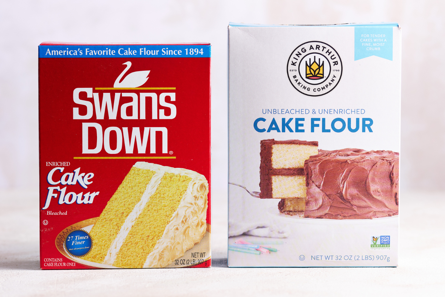 Swans Down cake flour and King Arthur Cake Flour in boxes, side by side.