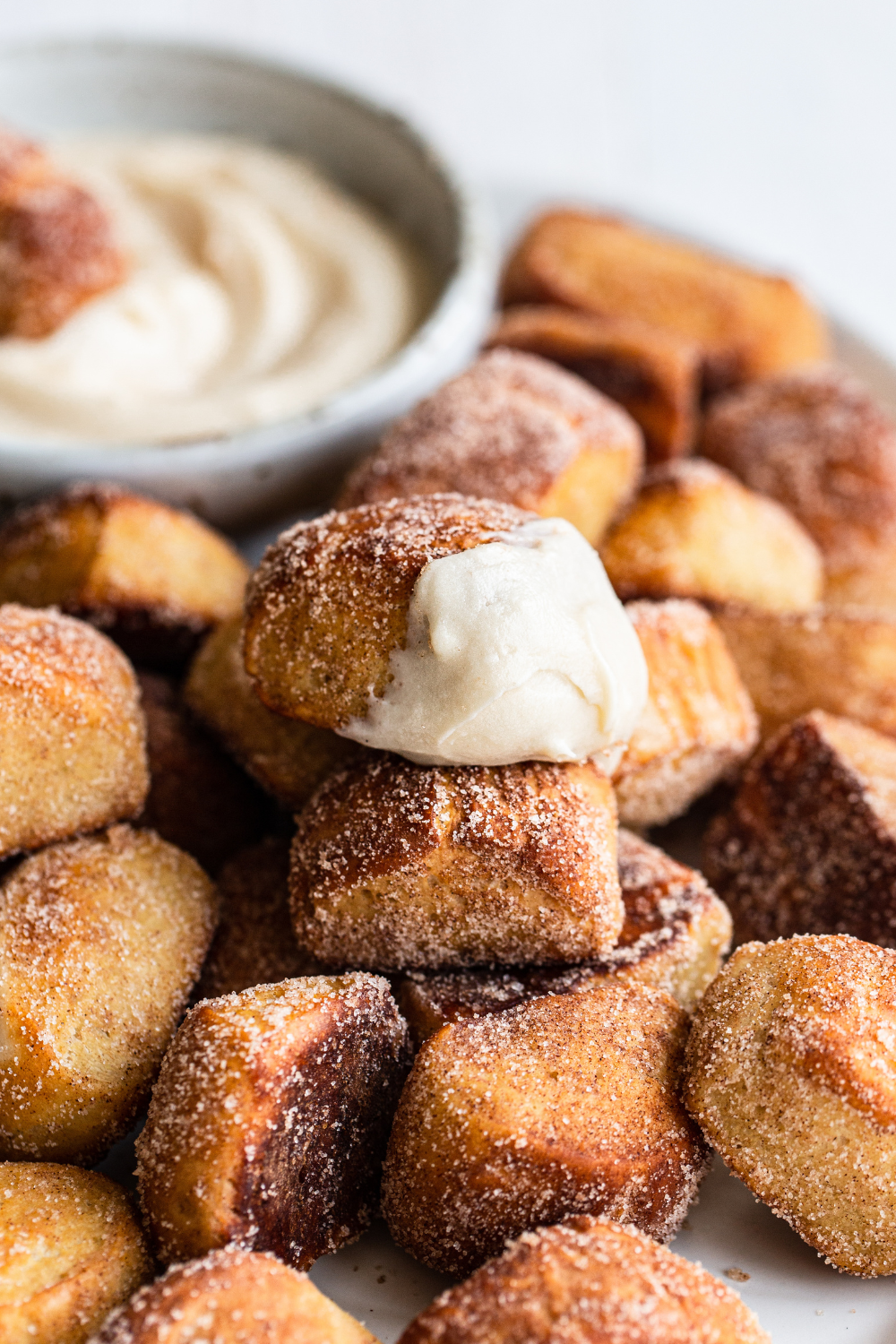 Cinnamon Sugar Pretzel Bites with cream cheese frosting for dipping, ready to serve