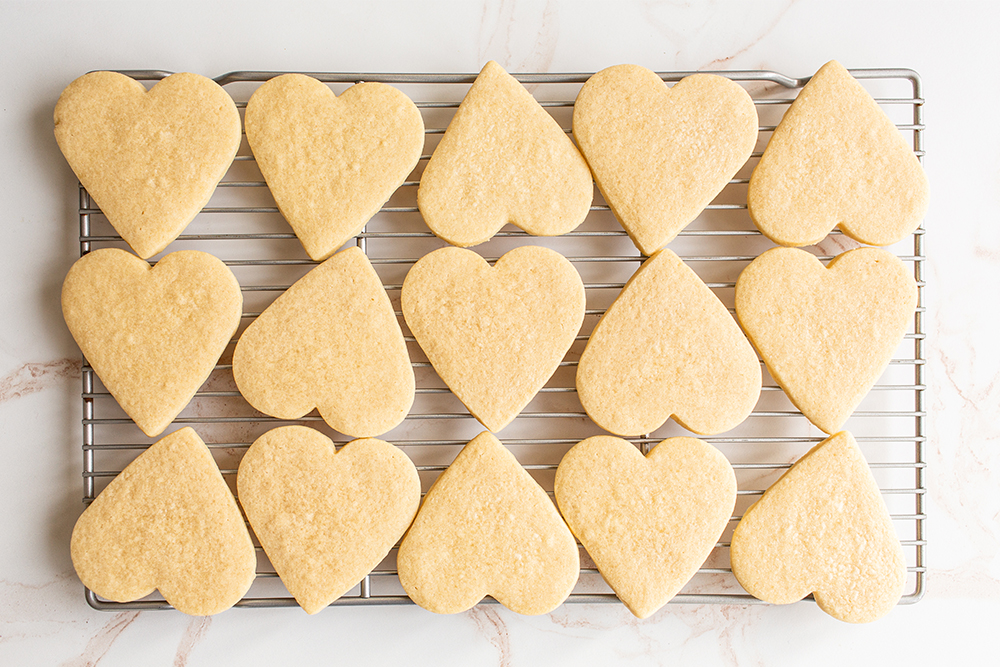 heart cookies on a cooling rack.