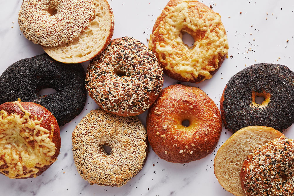an assortment of bagels with all different toppings