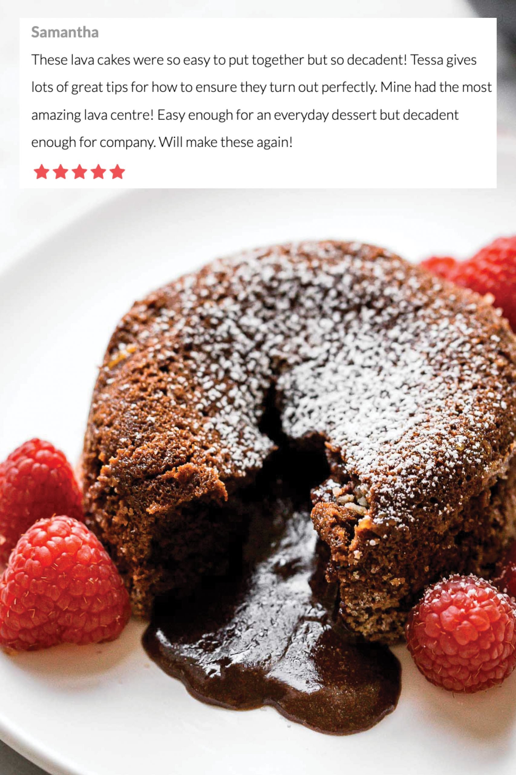 Chocolate Lava Cakes on a plate with raspberries, with the chocolate lava center flowing out. Such a decadent and easy dessert recipe. 