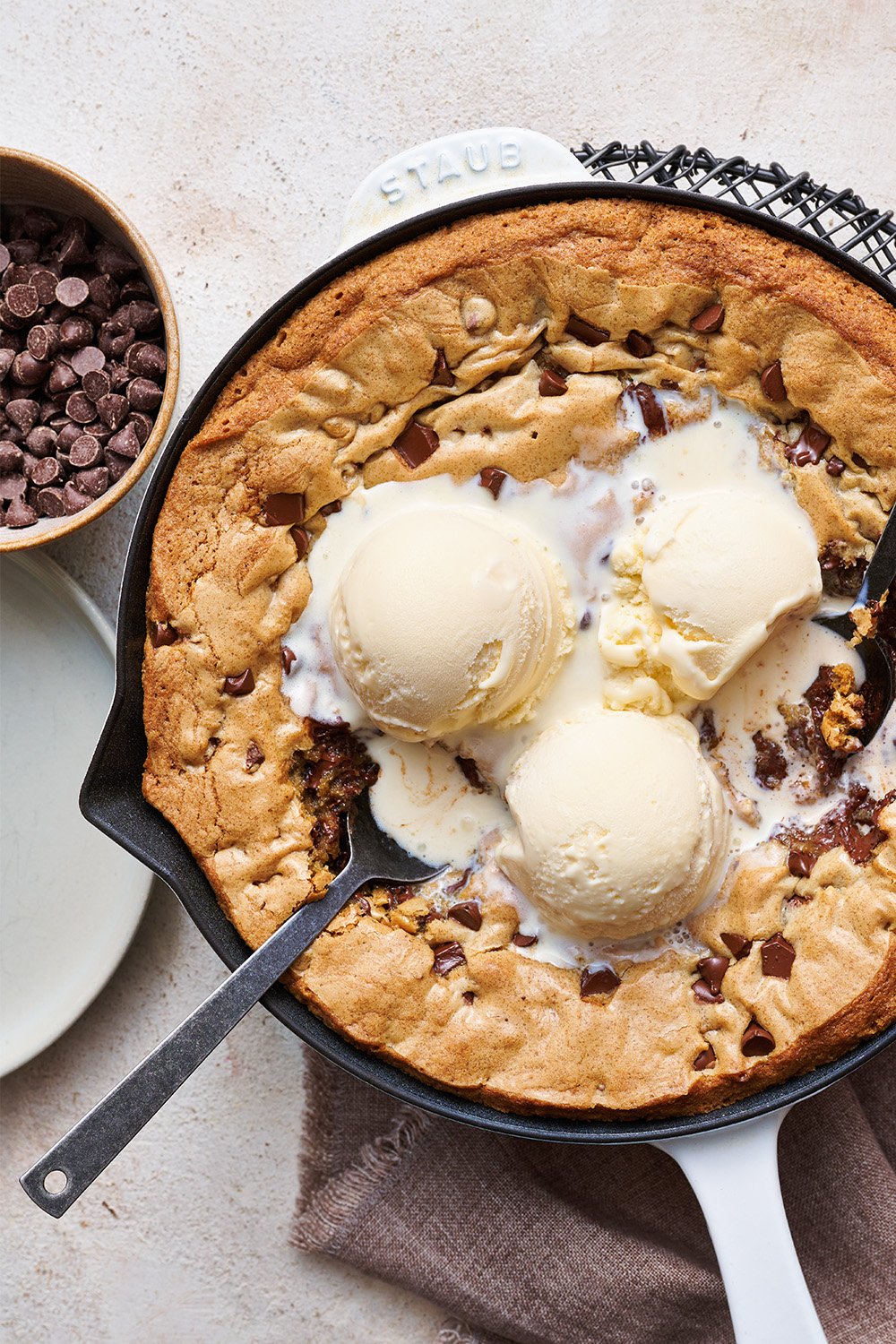 spoons taking bites out of chocolate chip pizookie recipe