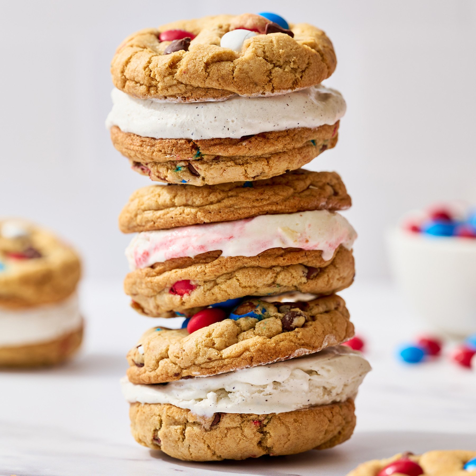 stack of easy homemade 4th of july ice cream sandwiches with festive red white and blue m&ms