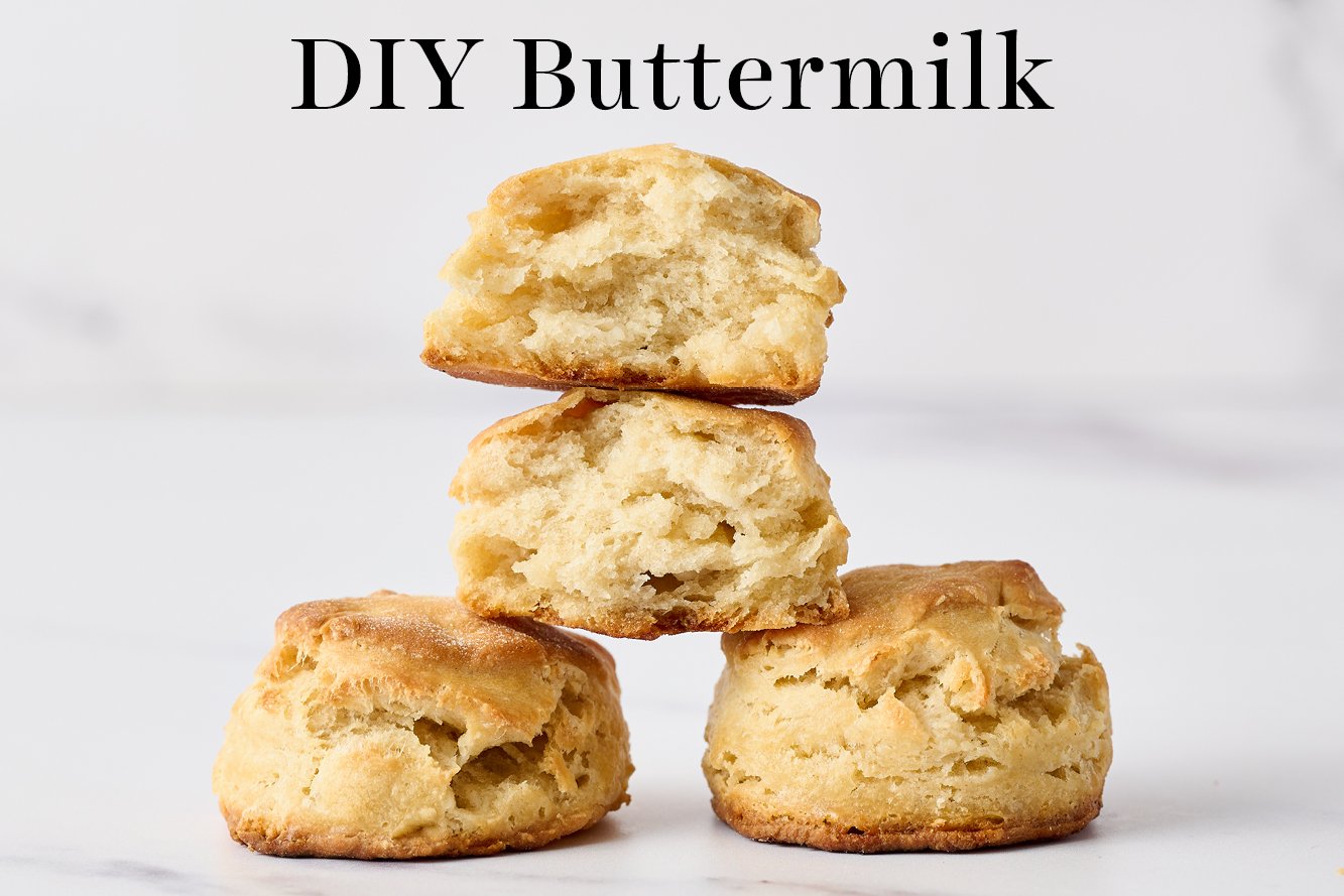 biscuits made with DIY Buttermilk, with one torn open so you can see the inside of the biscuit and how it differs from the biscuits made with real buttermilk