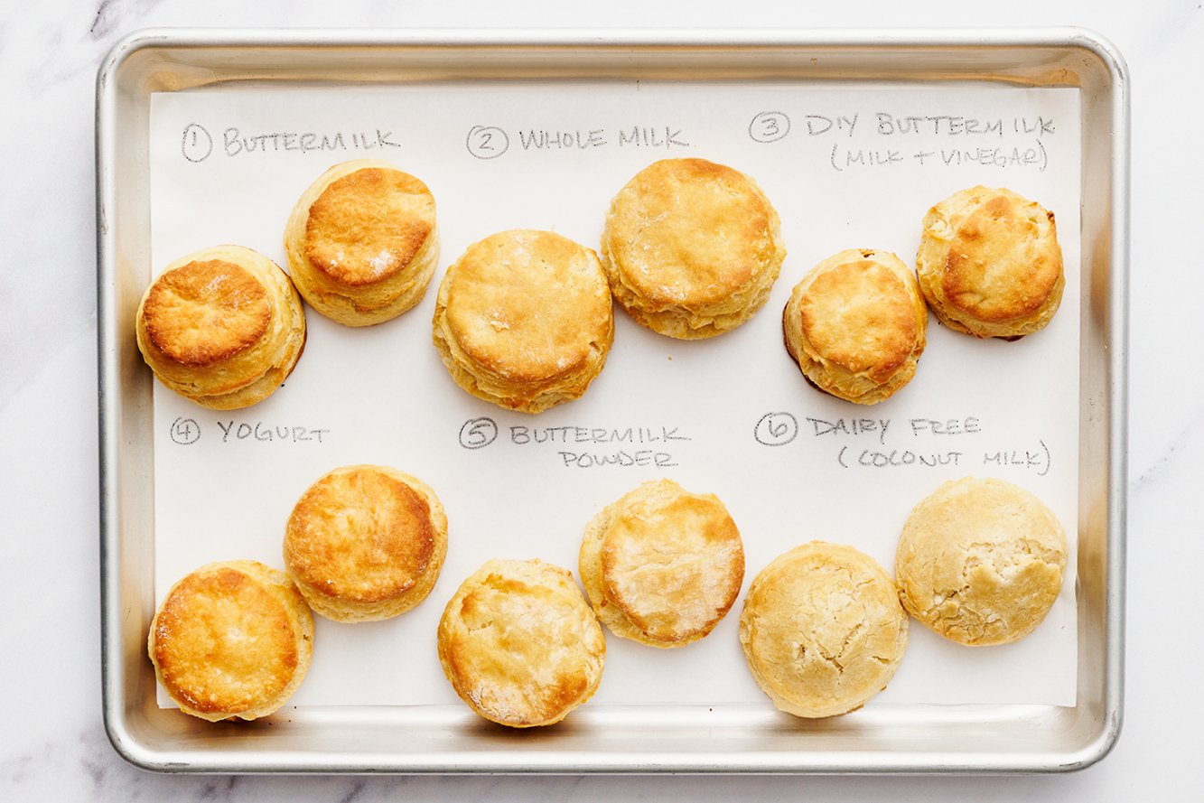 experiments with buttermilk substitutions using buttermilk biscuits, all side-by-side on a baking tray