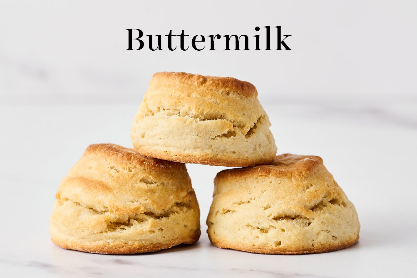 three buttermilk biscuits stacked in a pyramid
