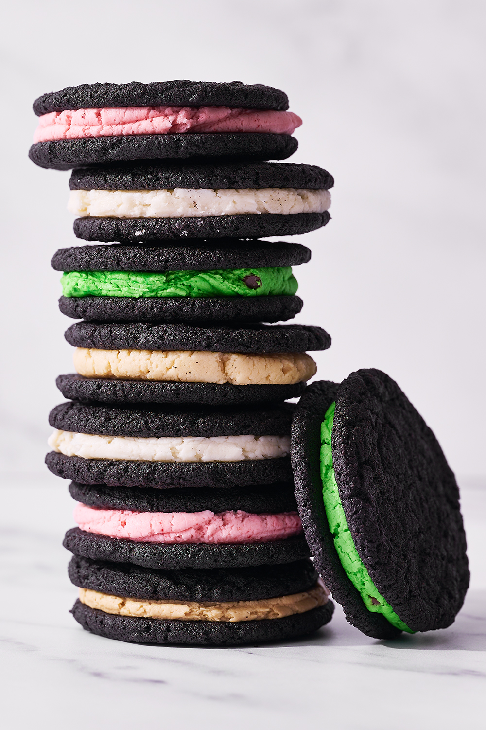 stack of homemade Oreos will a variety of different flavored fillings
