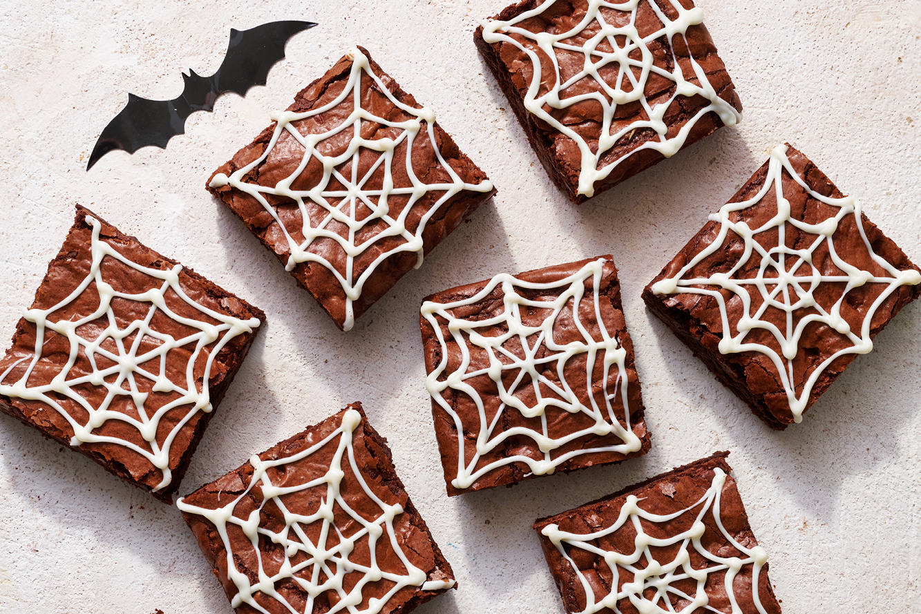 spooky cobweb brownies cut into slices