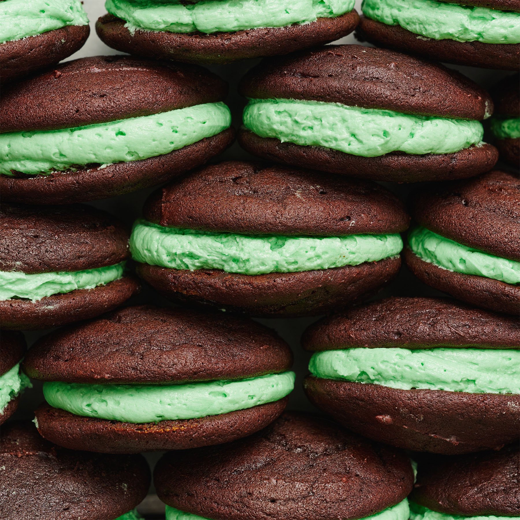 chocolate mint whoopie pies stacked closely together