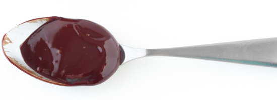 1:1 Ratio ganache on a spoon, showing the texture of this ganache ratio
