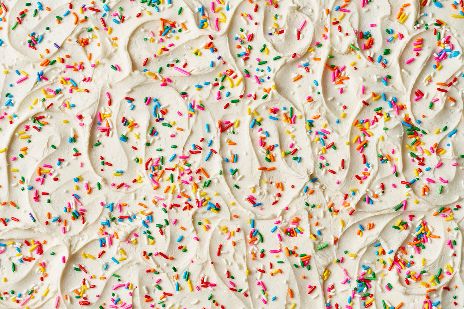 frosting with rainbow sprinkles all over the top.